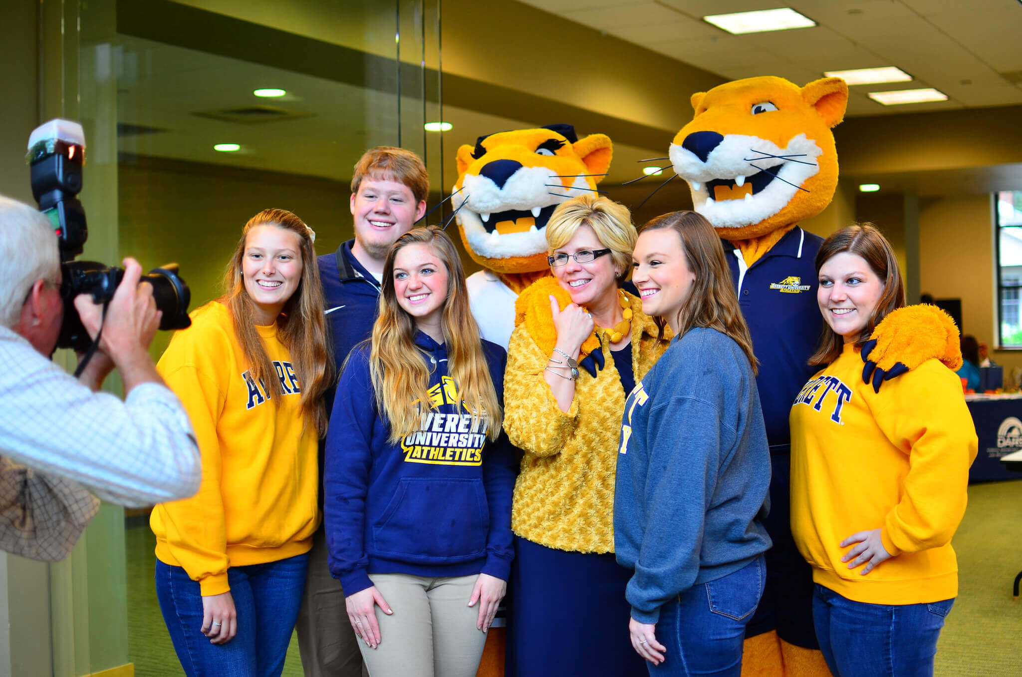 students and dr. franks pose with mascots